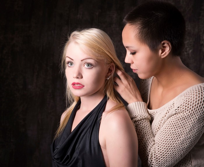 Two women, one with blonde hair, the other with short dark hair