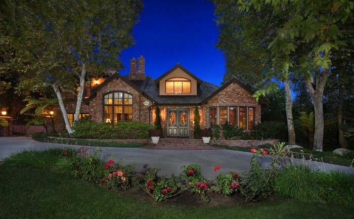 Brick house with arched windows at night