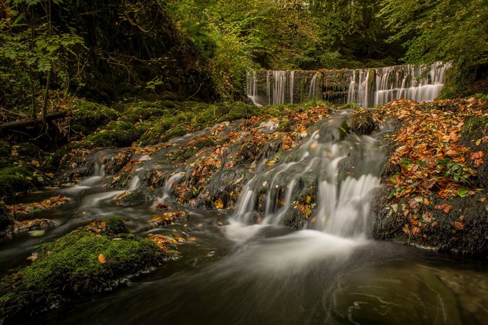 Autumn waterfall with foliage in the Lake District, England
