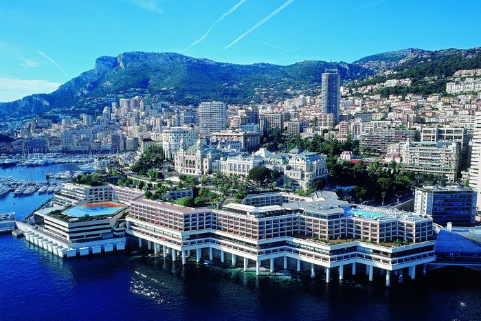Monte Carlo cityscape with marina and mountains