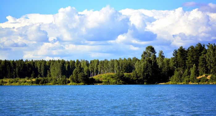 Lake with forest and clouds