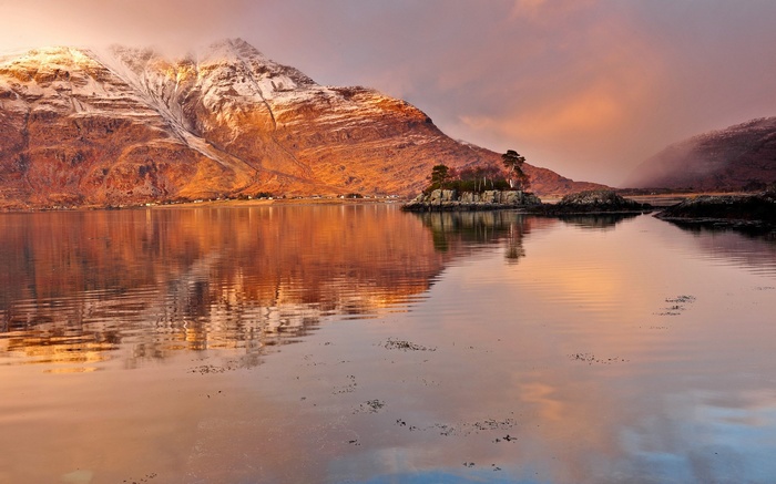 Mountain landscape with a small island in a lake