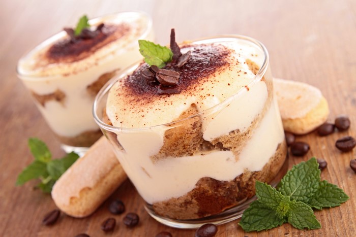 Tiramisu desserts with coffee beans and mint