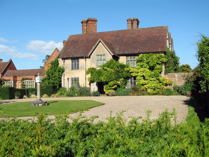 Packwood House, United Kingdom, with lawn and shrubs