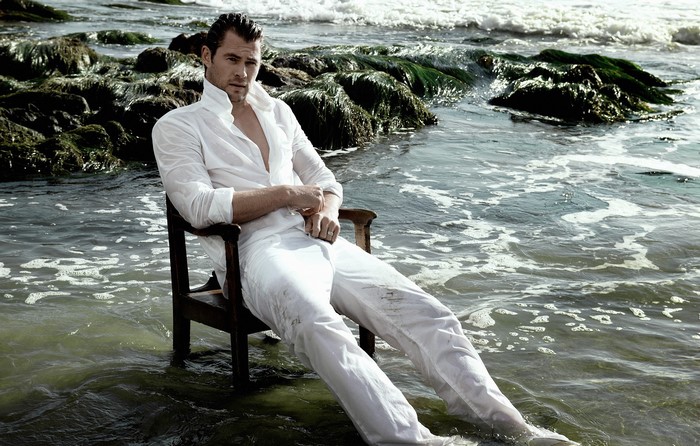 Chris Hemsworth sitting in the sea