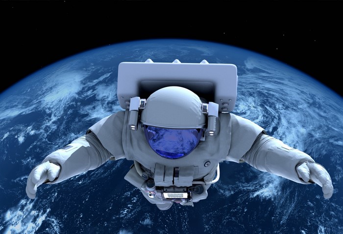 Astronaut floating above Earth