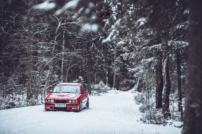 Red BMW E36 3 Series Wagon in Snowy Forest