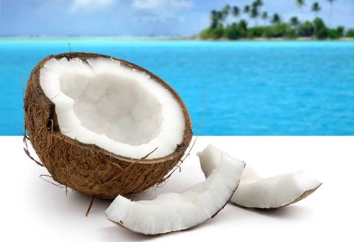 Coconuts on a beach background