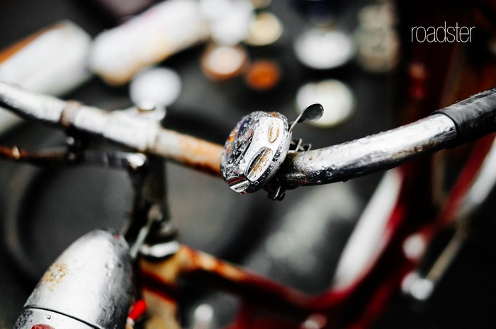 Bicycle handlebar with bell and water droplets