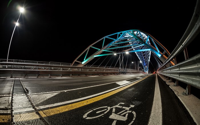 Night view of a modern bridge with colorful lights