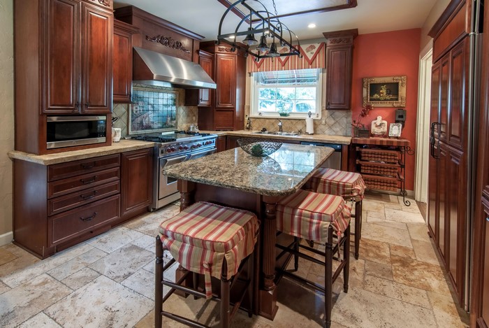 Kitchen with dark wood cabinets and island