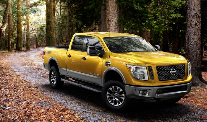 Yellow Nissan Titan XD Truck in Forest