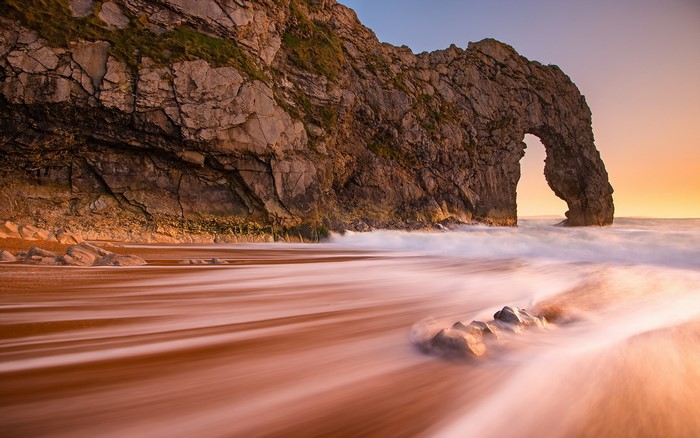 Durdle Door rock arch at sunset