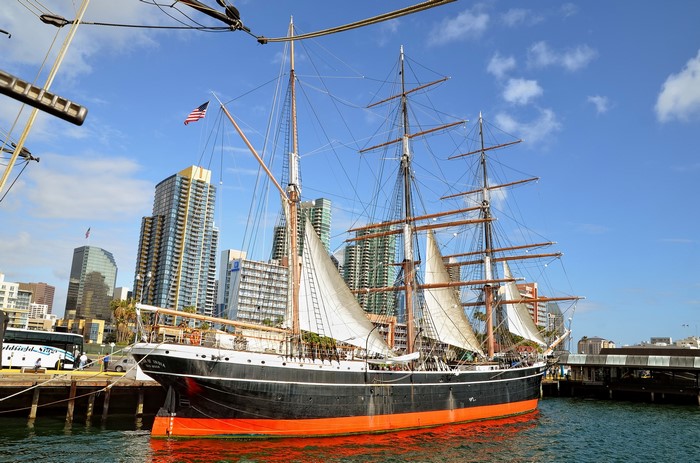 Star of India tall ship docked in San Diego with skyscrapers