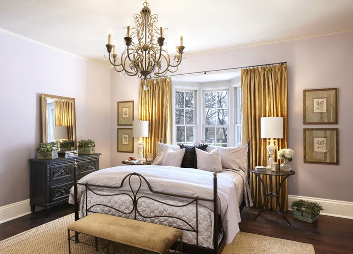 Bedroom with Chandelier and Gold Curtains
