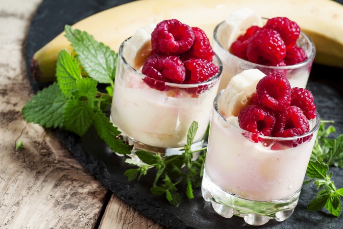 Dessert with raspberries, banana, and mint
