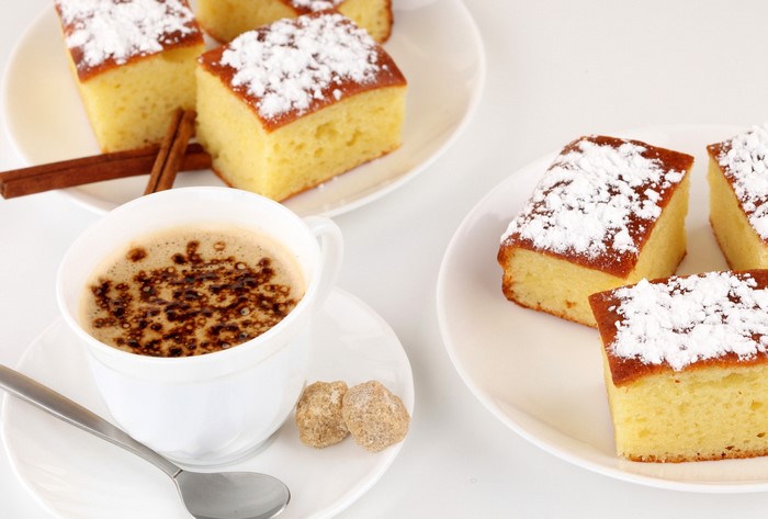 Coffee and cakes with cinnamon sticks