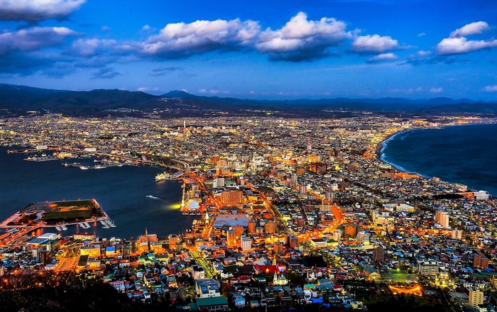 Hakodate cityscape at dusk with ocean and mountains