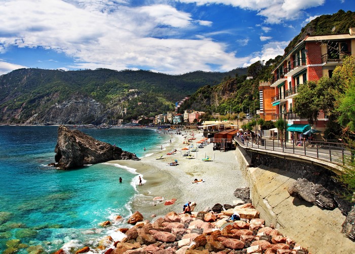 Monterosso beach with colorful houses and mountains, Italy