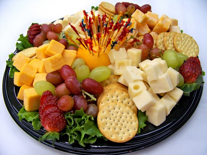 Cheese and fruit platter with crackers