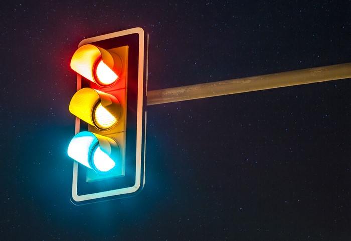 Traffic light at night with stars