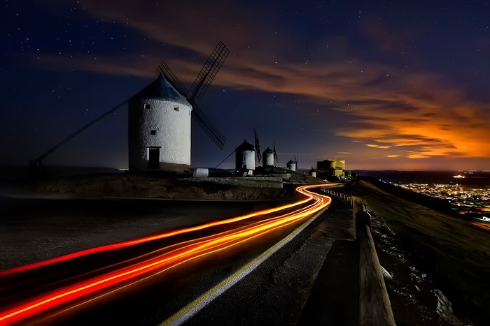 Windmills and light trails at night in Spain