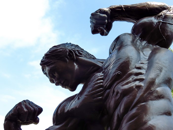 Bronze statue of two muscular men