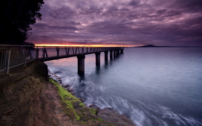Pier over the sea at sunset