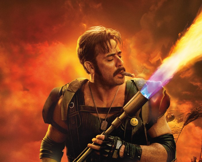 The Comedian from Watchmen holding a flamethrower