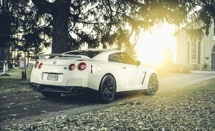 White Nissan GT-R parked in a cemetery