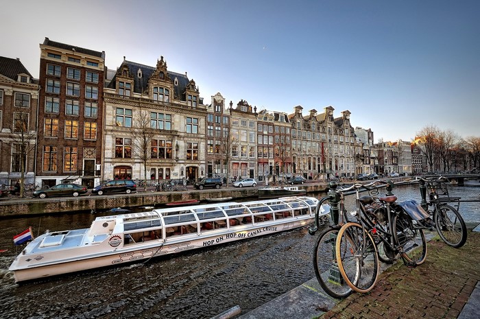 Amsterdam canal cruise with houseboats and bicycles