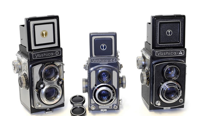 Three vintage Yashica twin-lens reflex cameras