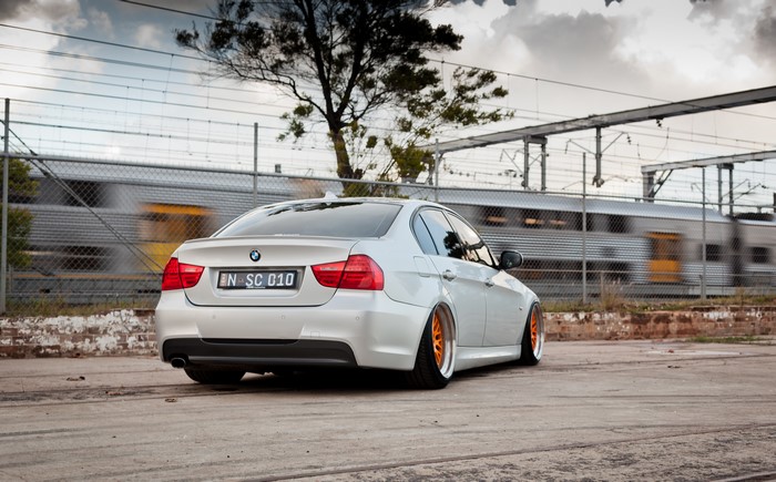 White BMW E90 320d with orange rims