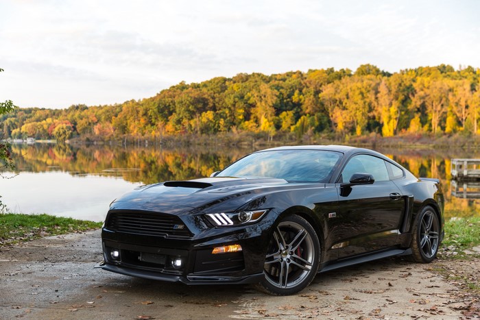 Black 2014 Roush Stage 2 Mustang by a lake