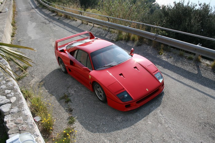 Red Ferrari F40 on a Winding Road