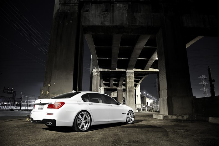 White BMW 7 Series 750Li F02 under bridge
