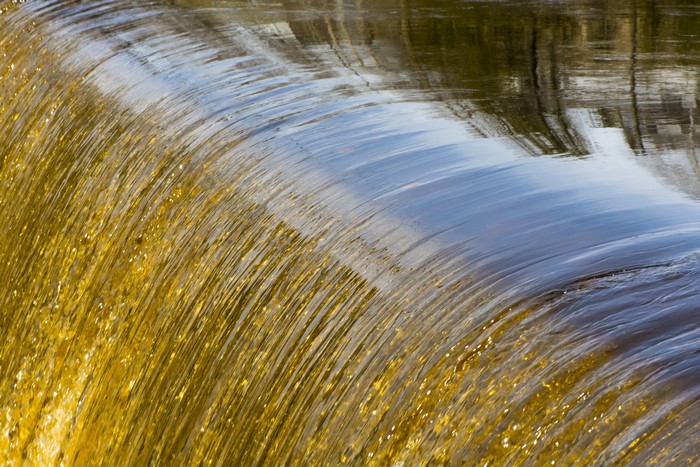 Water flowing over a weir