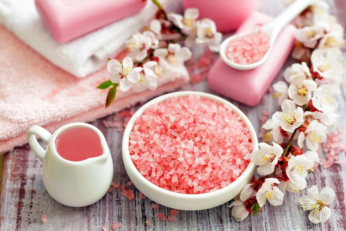 Pink spa items with cherry blossoms