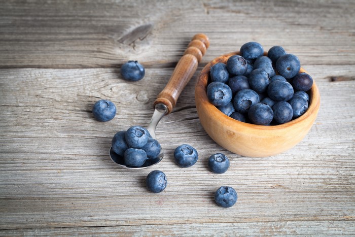 Blueberries in a bowl and spoon
