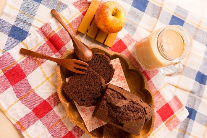 Chocolate cake slices with apple and coffee in a jar