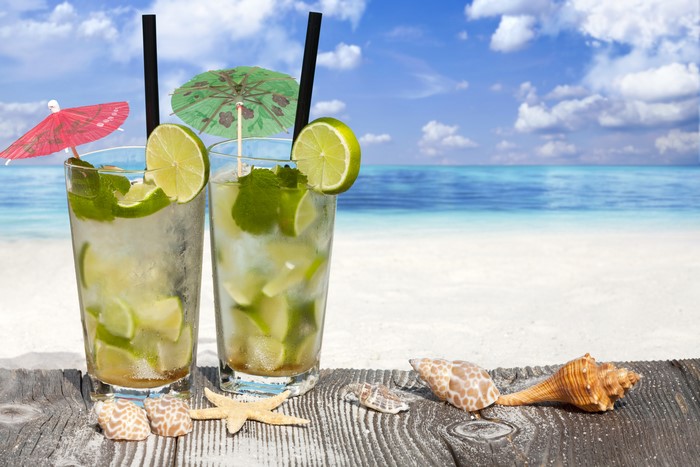 Two Mojitos on a Beach with Seashells