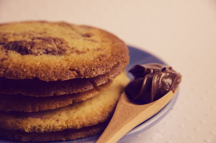 Stack of cookies with chocolate on a spoon