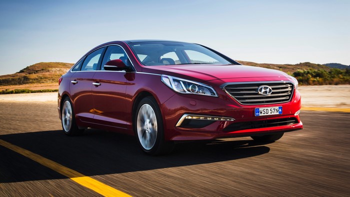Red 2015 Hyundai Sonata AU-spec LF driving