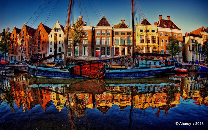 Canal with boats and houses in Groningen, Netherlands