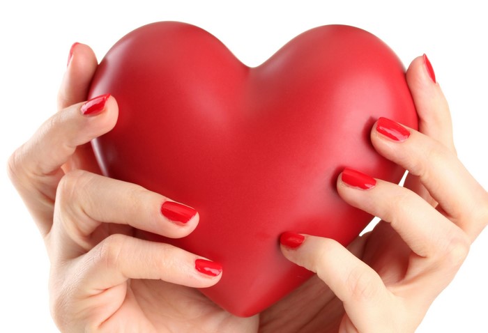 Hands holding a red heart
