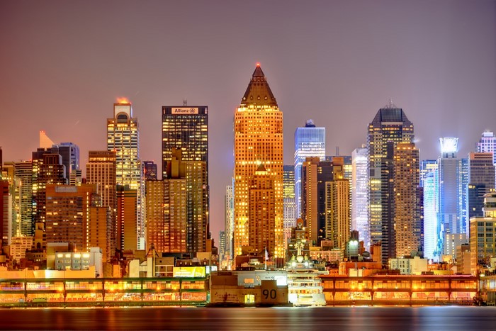 New York City skyline at night with illuminated skyscrapers