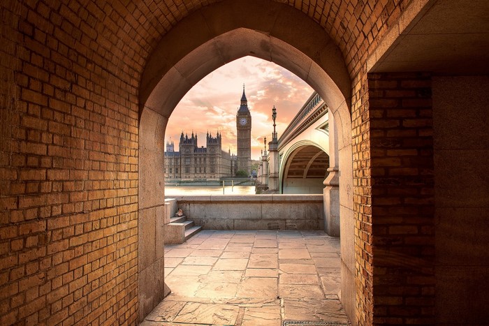 Big Ben and Houses of Parliament through an archway in London
