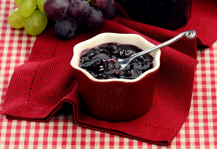 Grape Jam in a Bowl with Spoon and Grapes