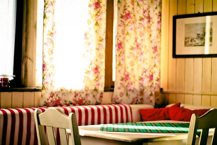 Room with curtains and table