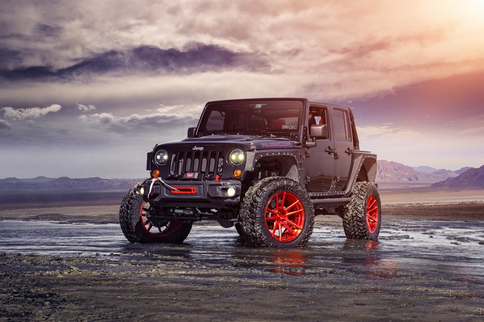 Black Jeep Wrangler Rubicon ADV1 with red wheels